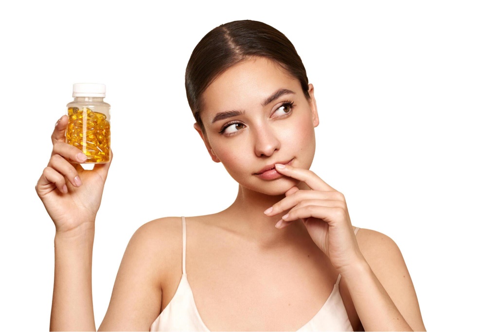 Woman with skin care supplements